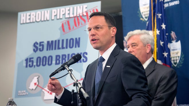 Josh Shapiro, attorney general of Pennsylvania, left, details how law enforcement shut down a heroin pipeline that operated from New York City to York to Altoona. Behind him is Tom Kearney, district attorney of York County.