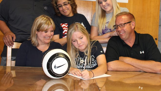 Tayler Rinehart signed her letter of uintent to play soccer for Pima Community College in Tucson, AZ surrounded by, clockwise from left, Bernie Chavez, Yvonne Jasso-Perales, Kenzie Rinehart, Bo Rinehart and Melanie Rinehart.