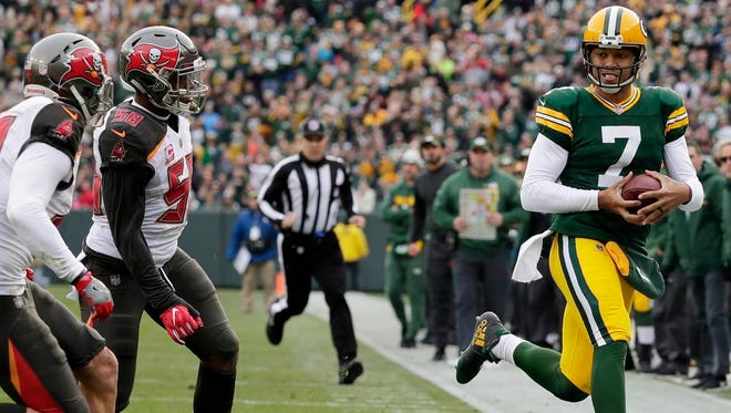 Green Bay Packers quarterback Brett Hundley (7) scrambles out of bounds against the Tampa Bay Buccaneers in the second quarter at Lambeau Field on Sunday, December 3, 2017 in Green Bay, Wis.