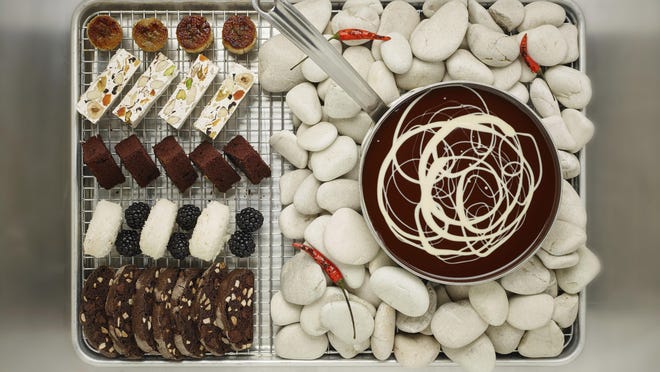 This April 7, 2017 photo provided by The Culinary Institute of America shows a chocolate fondue in Hyde Park, N.Y. This dish is from a recipe by the CIA. (Phil Mansfield/The Culinary Institute of America via AP)