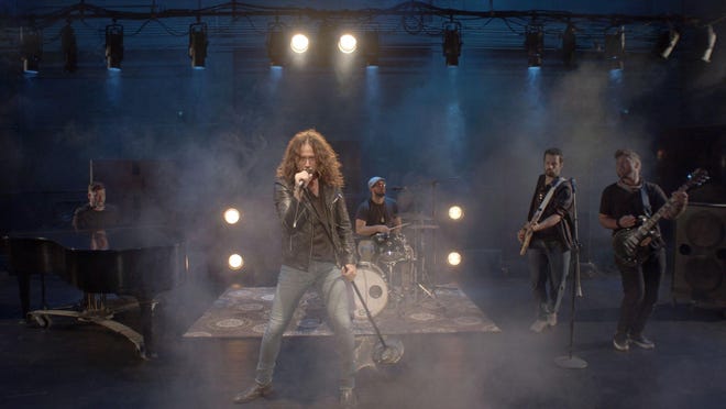 Constantine Maroulis (front) filming his new music video "Try" onstage at the Palace Theatre. Portraying his band are (back, from left) Ryan Doyle, Nate Monea, Scott Paris and Dan Monea.