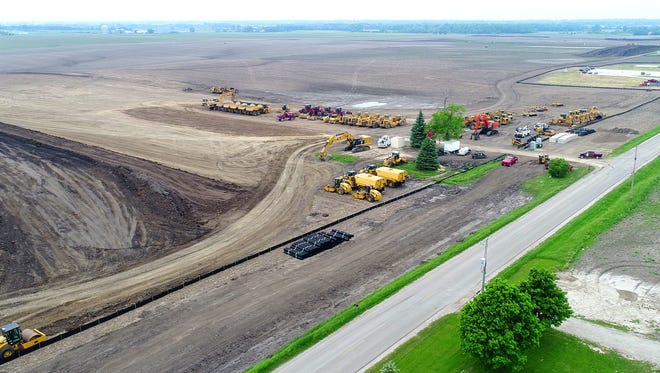 Looking southwest across the Foxconn facility site, where work has begun to prepare for construction of 22 million square feet of buildings. Next step: delivery of as many as 1,000 dump-truck loads of gravel per day.