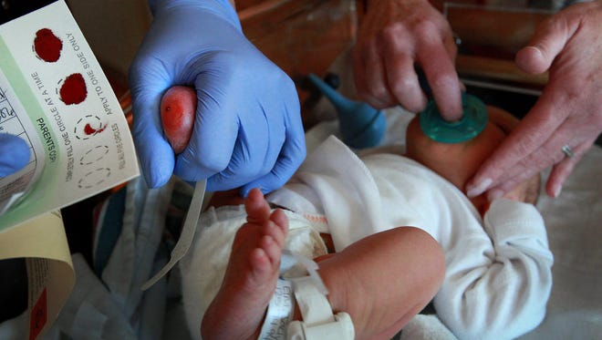 A newborn is tested for rare diseases.