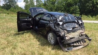 The unmarked police car off-duty Indiana Metropolitan Police chief Deputy James Waters was driving when hit from behind by a semi Sunday afternoon. Waters remains in critical condition.