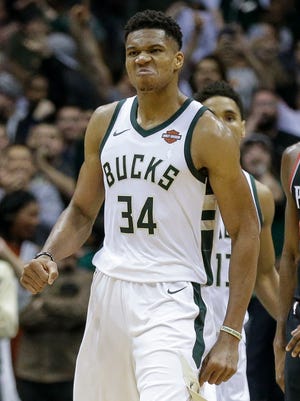 Milwaukee Bucks' Giannis Antetokounmpo reacts after making the go-ahead basket against the Portland Trail Blazers.
