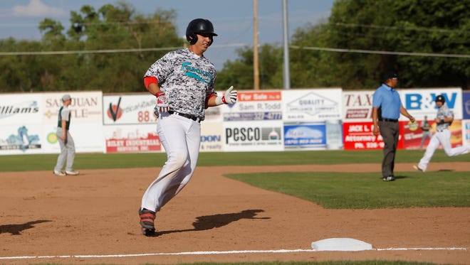 Robby Campillo of the Farmington Frackers easily reaches third base against the Colorado Cutthroats during Saturday’s game at Ricketts Park. Campillo and other UNM players represent a balance of power and speed, which is the Fracker offense's mold this season.