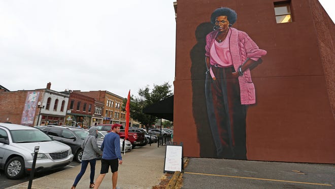 A mural depicting poet Mari Evans has risen along Massachusetts Avenue and was dedicated on Saturday, Aug. 13, 2016. It was painted by artist Michael Alkemi Jordan.