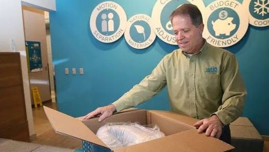 Tom Metz, vice president of product development for Verlo Mattress demonstrates the Verlo-to-Go product. It's ready to sleep on right after unboxing but will come to full height in 24 hours.
