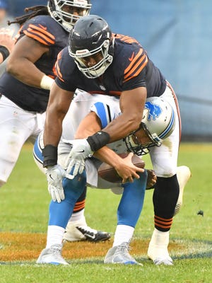 Lions quarterback Matthew Stafford is crushed by the Bears' Cornelius Washington late in the fourth quarter on Sunday in Chicago.