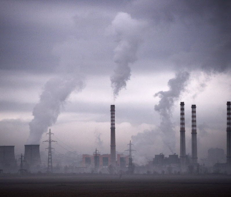 Smoke rises from a thermal power station.