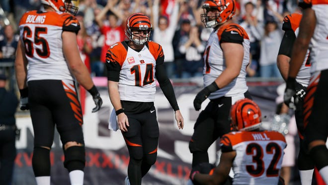 Cincinnati Bengals quarterback Andy Dalton (14) leaves the field after being sacked in the end zone for a safety in the third quarter of the NFL Week 6 game between the New England Patriots and the Cincinnati Bengals at Gillette Stadium in Foxboro, Mass., on Sunday, Oct. 16, 2016. The Bengals fell to 2-4 with a 35-17 loss in Tom Brady's first home game since his four-game suspension. 