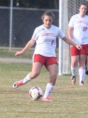 Adamsville's Kallie Martindale looks to pass the ball to a teammate during their soccer game against Peabody, Tuesday, October 17. Adamsville defeated Peabody, 4-3.