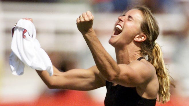 Brandi Chastain celebrates after kicking the winning penalty shot to win the 1999 Women's World Cup final against China 10 July 1999 at the Rose Bowl in Pasadena.