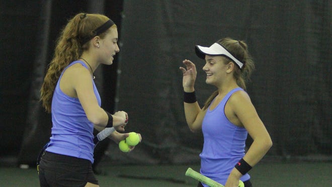 Ursuline's Vanessa Ciano and Laina Campos congratulate each other after winning a point during the 2016 Section 1 Tennis Tournament finals at Sound Shore Indoor Tennis in Port Chester on Sunday, Oct. 23rd, 2016.