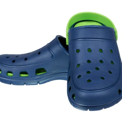 Pair of Crocs classic clogs in blue, with a green 