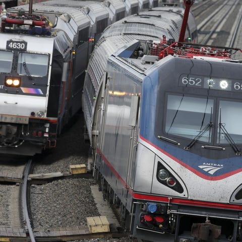 An Amtrak train passes a New Jersey Transit train 