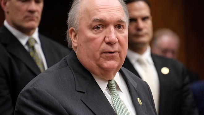 Former Michigan governor John Engler speaks at the Michigan State University Board of Trustees meeting after being selected to be the interim president of the university on Jan. 31.