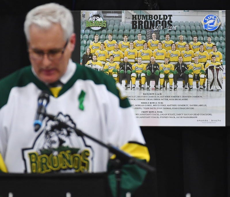 Mayor of Humboldt, Rob Muench, speaks on stage during a vigil at the Elgar Petersen Arena.