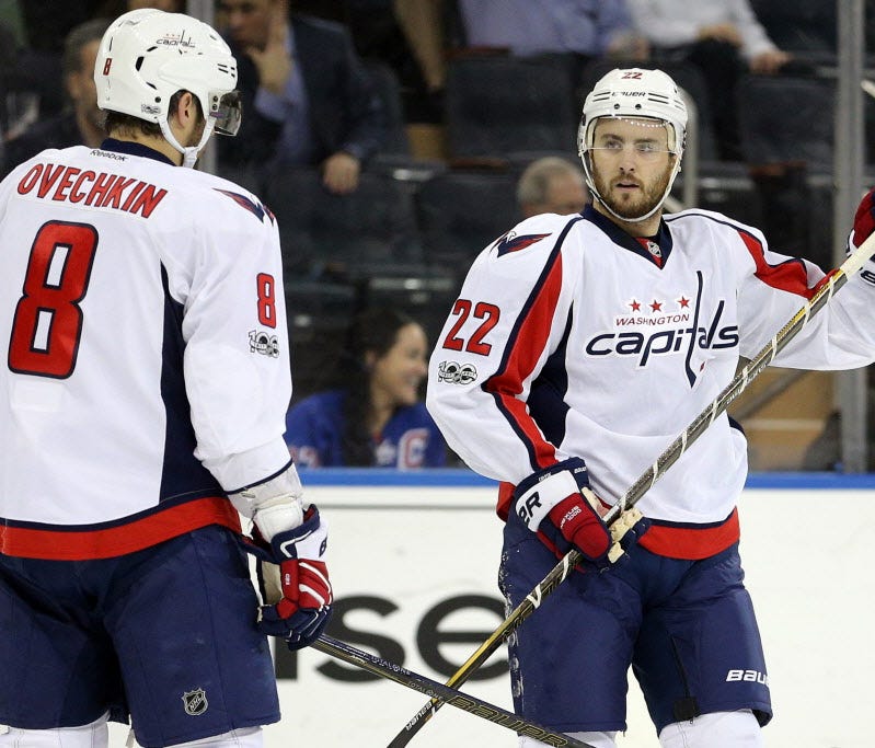 Washington Capitals defenseman Kevin Shattenkirk (22) talks to left wing Alex Ovechkin (8) during the first period against the New York Rangers.