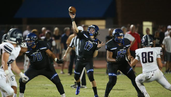 Chandler's Jacob Conover (16) throws a touchdown pass against Perry in the first half at Chandler High School in Chandler, Ariz. on October 6, 2017.