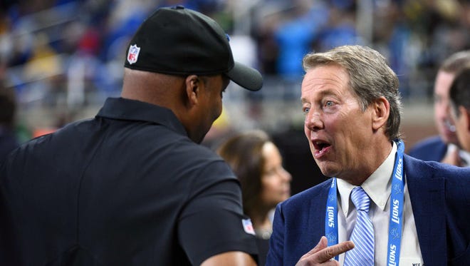 Ford Motor Company executive chairman Bill Ford, right, talks to Detroit Lions coach Jim Caldwell before the game against the Green Bay Packers on Jan. 1, 2017, at Ford Field.