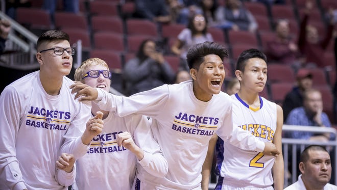 The Blue Ridge Yellow Jackets celebrate their win against the Valley Christian Trojans in the boys 3A semi-final at Gila River Arena on Friday, February 23, 2018 in Glendale, Arizona.