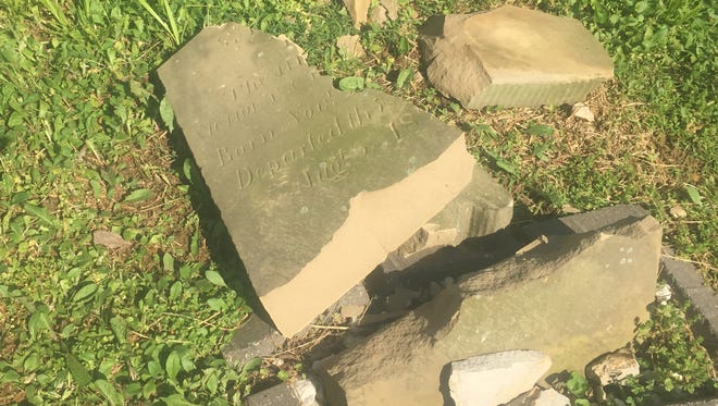 In photo from May of 2018, the gravestone of Ann Taylor Towles -- Gen. Samuel Hopkins' daughter -- lies shattered by vandals.