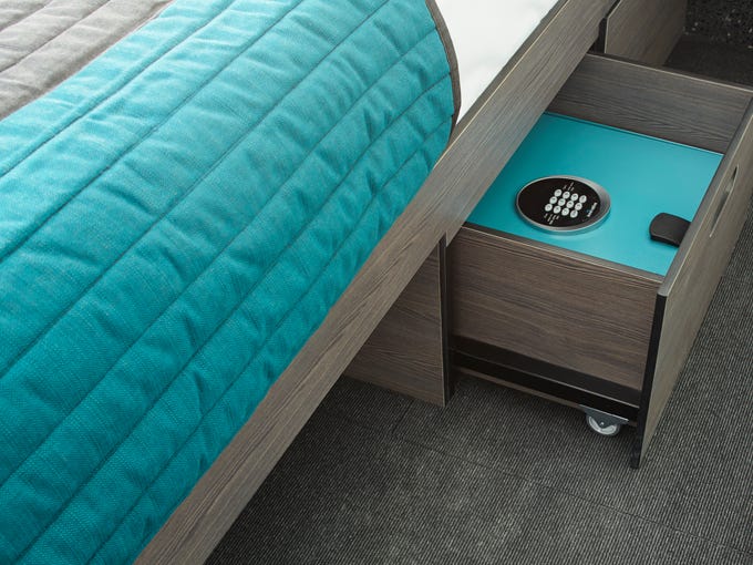Pod Hotels utilize space underneath beds for storage.