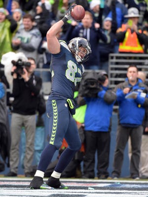 Jan 18, 2015; Seattle, WA, USA; Seattle Seahawks tight end Luke Willson (82) celebrates his two-point conversion catch against the Green Bay Packers during the fourth quarter in the NFC Championship Game at CenturyLink Field.
