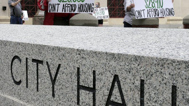 Advocates for low-wage workers demonstrated at City Hall in downtown Columbus on Thursday, May 28, 2020, calling for more affordable housing and assistance for those facing eviction due to the coronavirus pandemic.