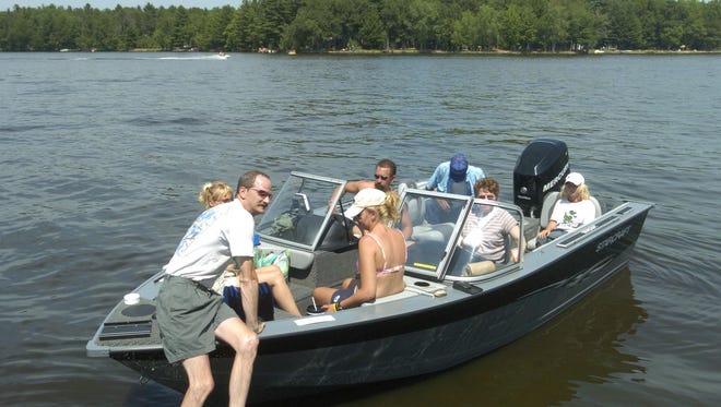A boatload of people leave the shore at the DuBay Park in this Journal Media file photo. County Parks Director Gary Speckmann said DuBay Park is popular because of its access to water, and the county is trying to expand it.