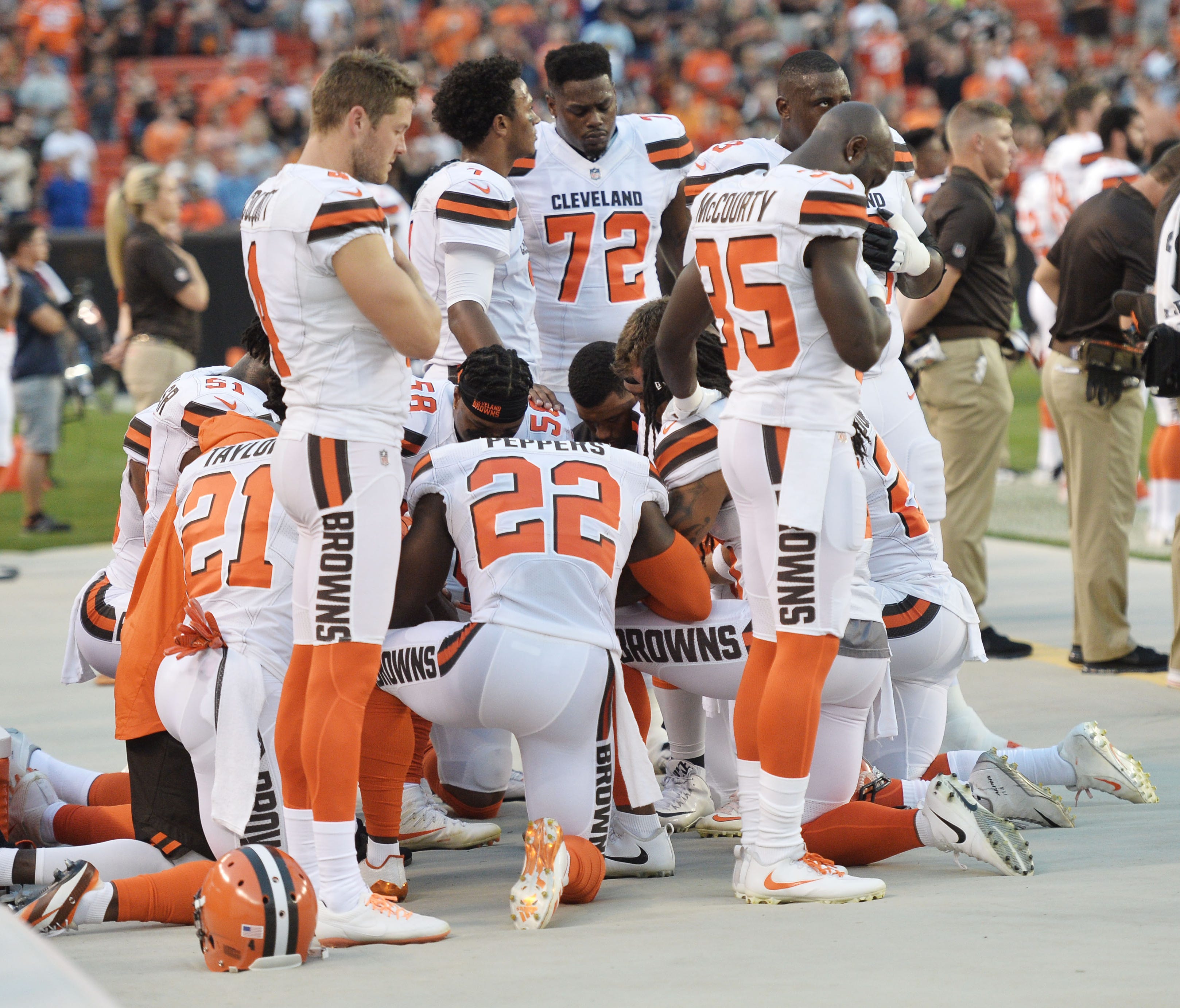Members of the Cleveland Browns kneel during the national anthem before a game against the New York Giants at FirstEnergy Stadium.