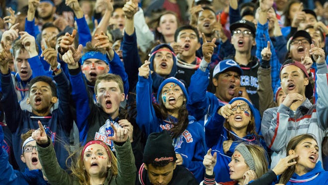 Las Cruces High School students cheer for their team on Friday, November 4, 2016, during the Cruces/Mayfield game at Aggie Memorial Stadium.