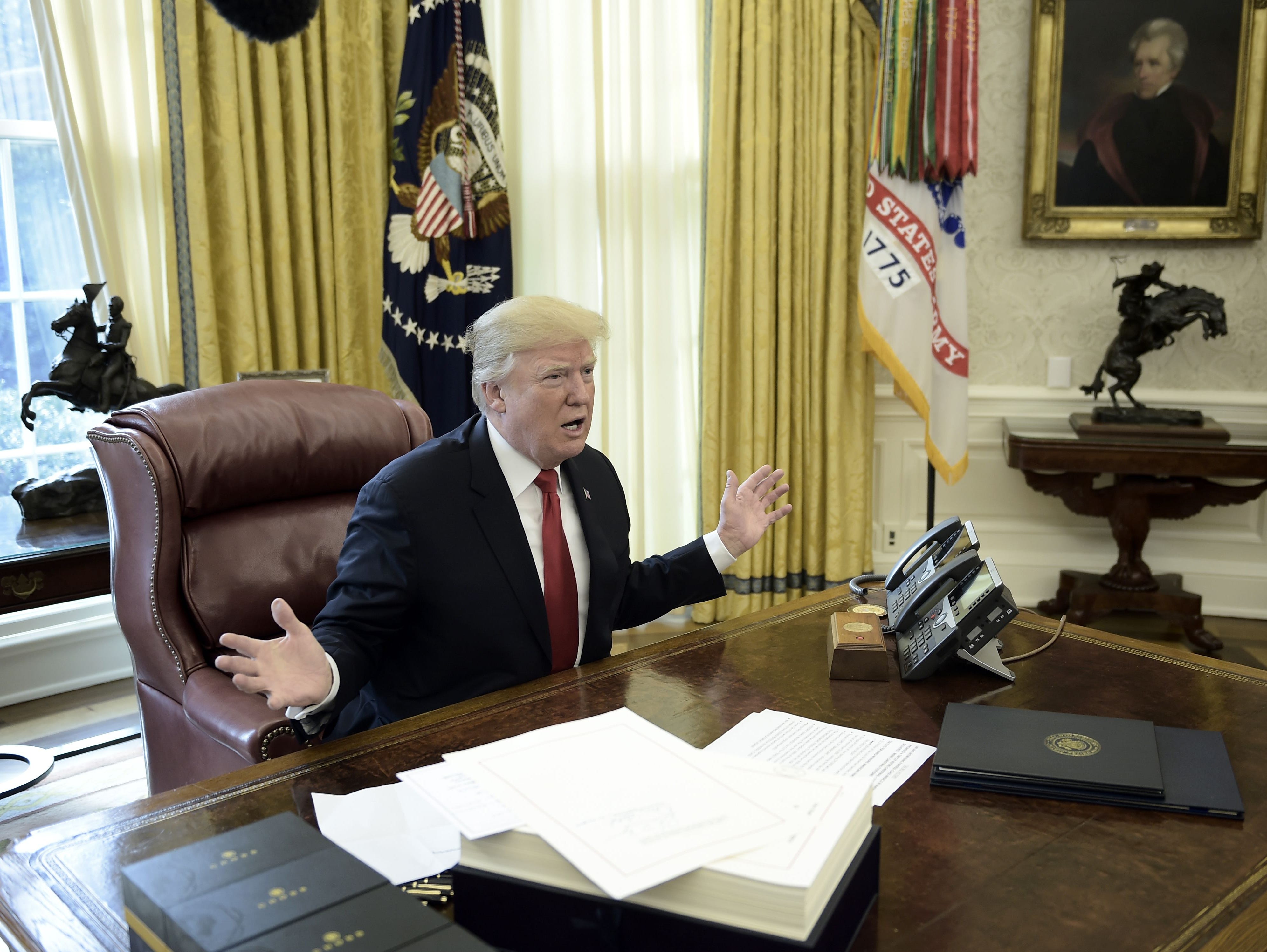 President Trump talks about taxes as he prepares to sign the Tax Cut and Reform Bill in the Oval Office at The White House in Washington, DC on Dec. 22, 2017