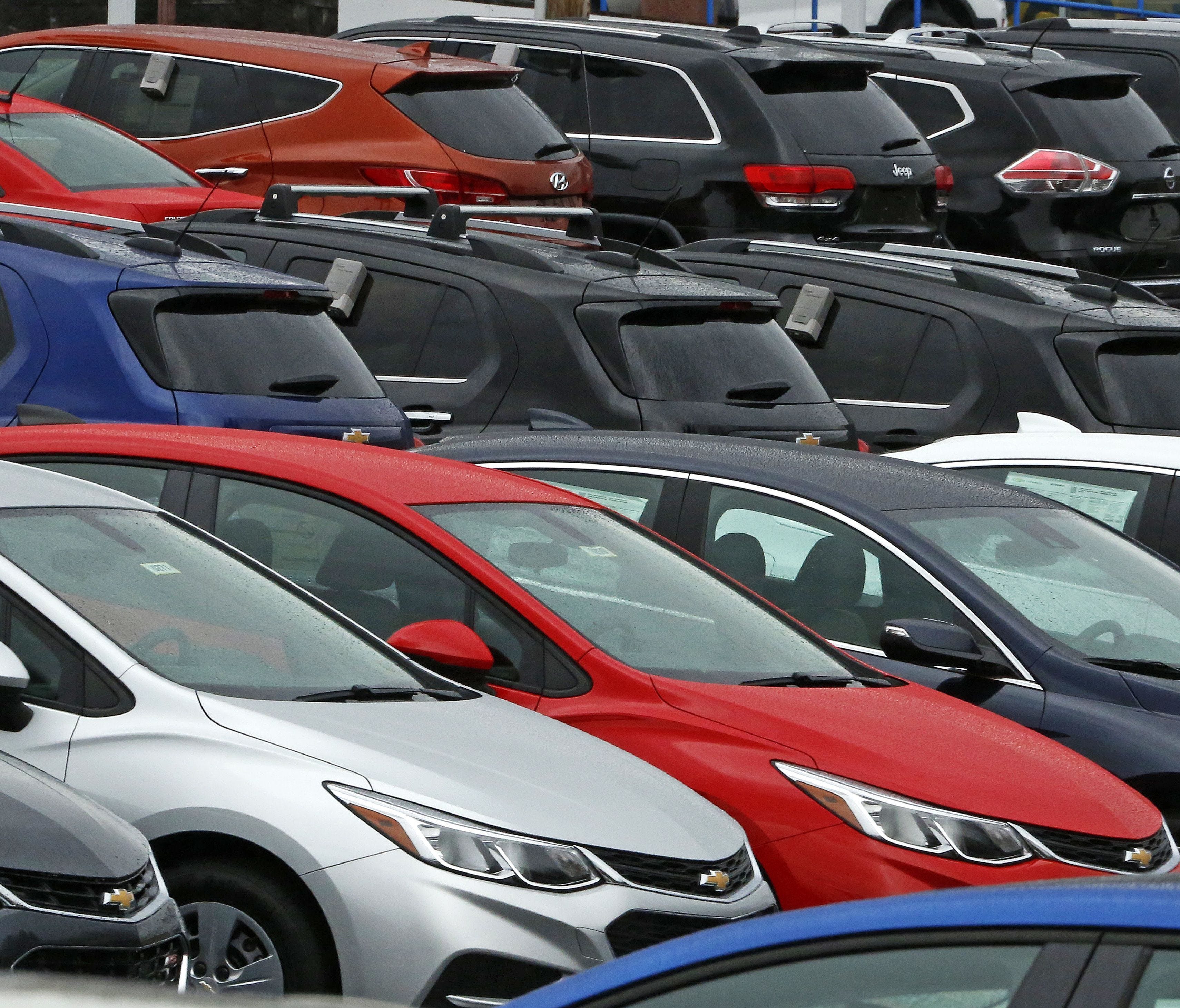 Chevrolet cars are positioned on a dealer lot in Pittsburgh.