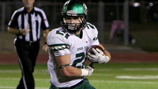 Iowa Park's Bowie Franks looks for a lane to run against Graham Friday night at Graham.