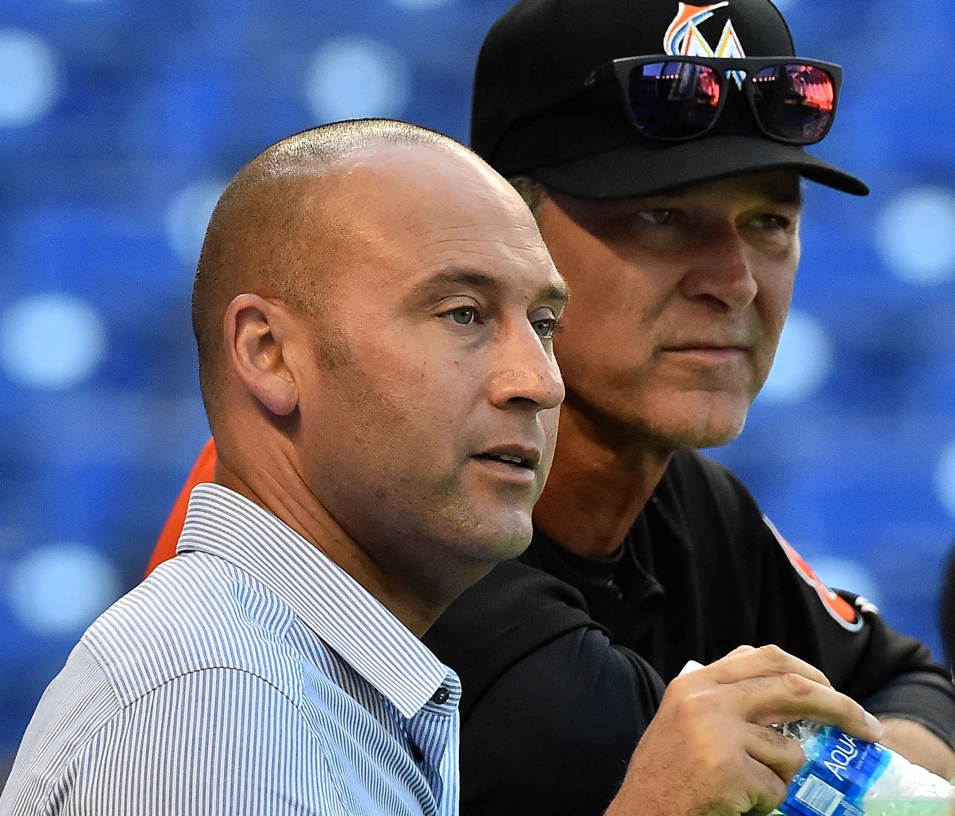 The Marlins are last in the NL East under CEO Derek Jeter (right) and manager Don Mattingly.