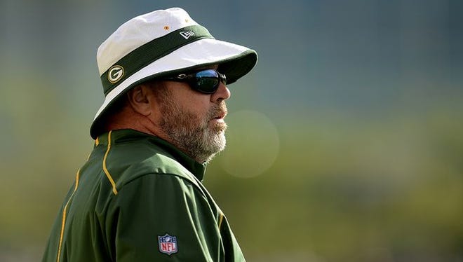 Green Bay Packers coach Mike McCarthy looks on during training camp practice at Ray Nitschke Field on Tuesday, Aug. 4, 2015.