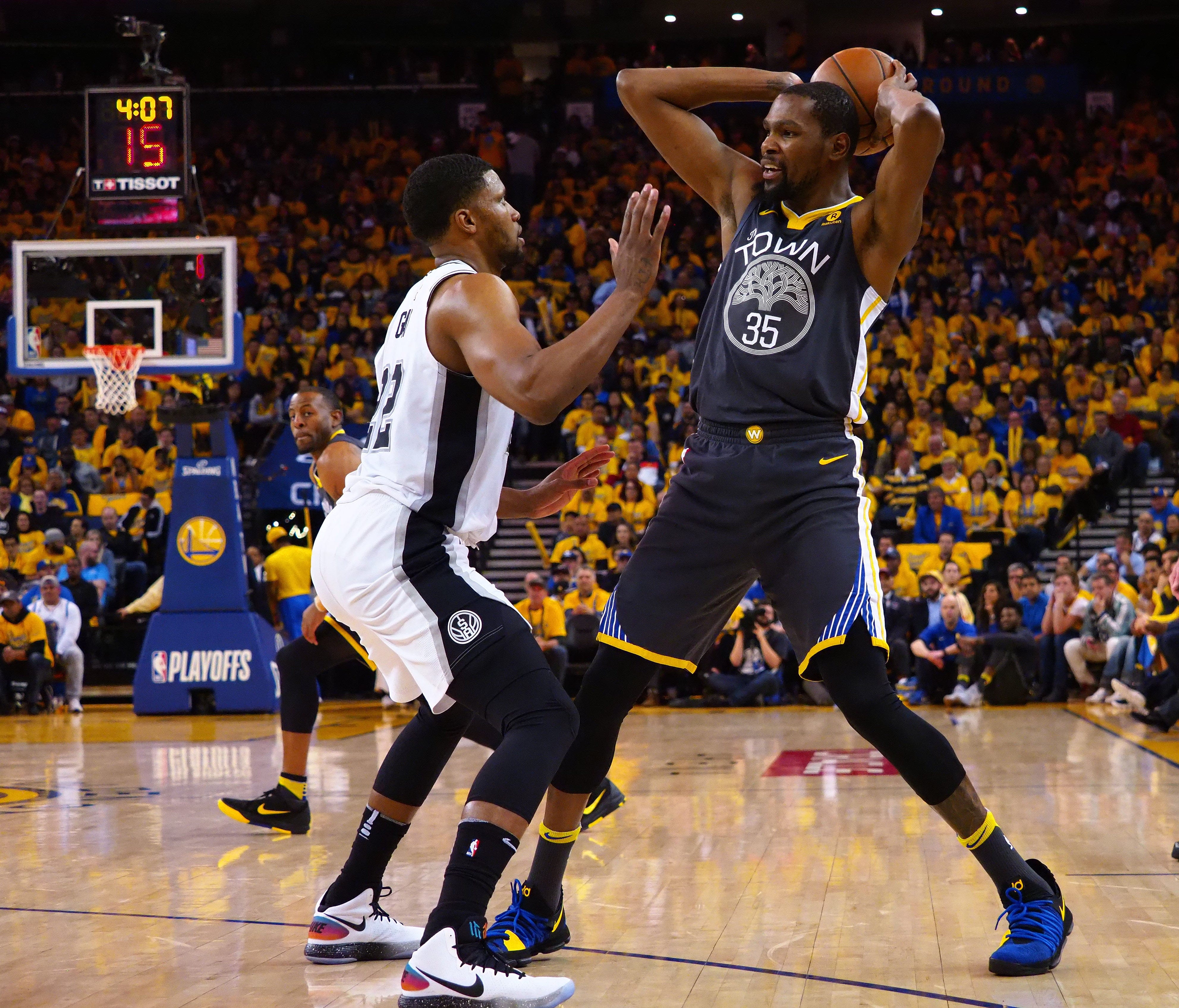 Golden State Warriors forward Kevin Durant (35) controls the ball against San Antonio Spurs forward Rudy Gay (22) during the second quarter in game two of the first round of the 2018 NBA Playoffs at Oracle Arena.
