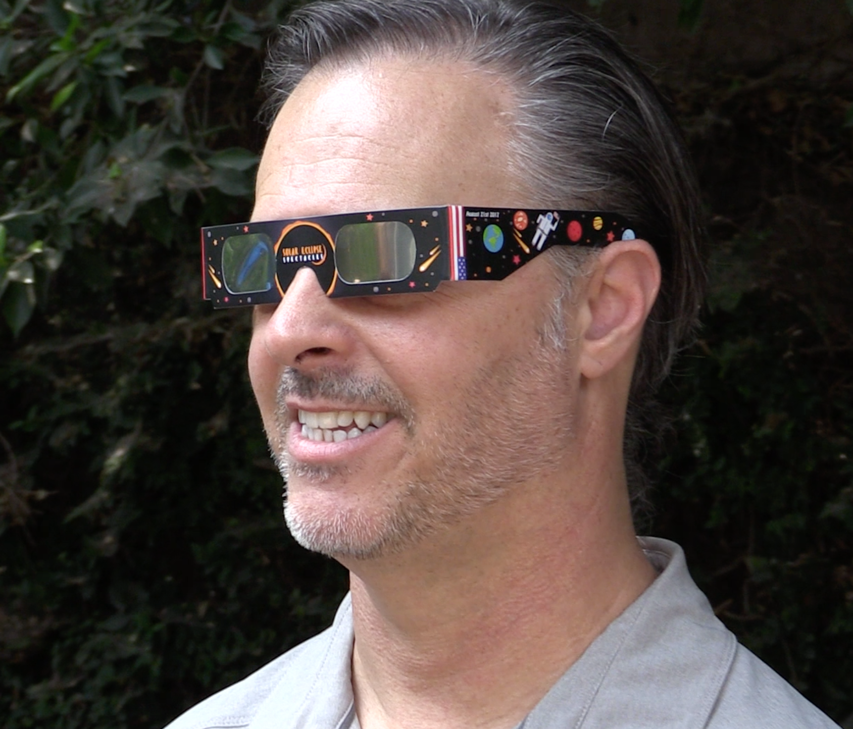 Astro-photographer Brian Valente sports filtered glasses for the summer eclipse