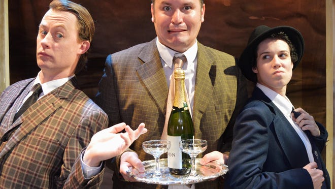 One Man, Matthew Lewis Johnson as Francis Henshall, center, tries to serve his two “guvnors”, Justin McCombs as Stanley Stubbers, left, and Caitlin McWethy as Rachel Crabbe, right, in Cincinnati Shakespeare Company’s 2015 production of “One Man, Two Guvnors.”