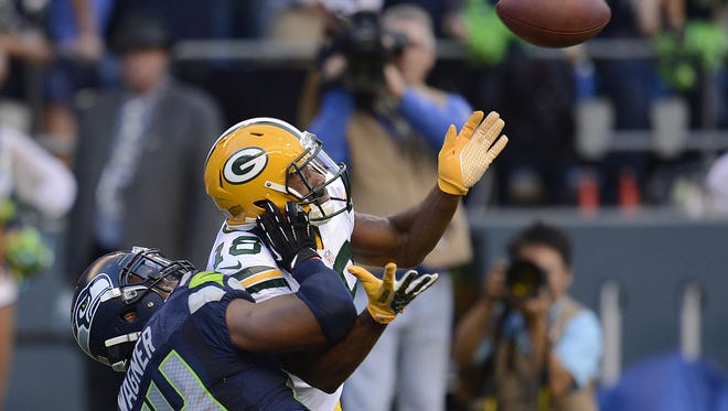 Green Bay Packers receiver Randall Cobb (18) collides with Seattle Seahawks linebacker Bobby Wagner (54) during their Week 1 game at CenturyLink Field in Seattle. Wagner was called for pass interference on the play.