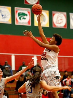 Lawrence North’s Ae'Rianna Harris (32) goes up high for the bucket against Carmel on Dec. 1, 2015.
