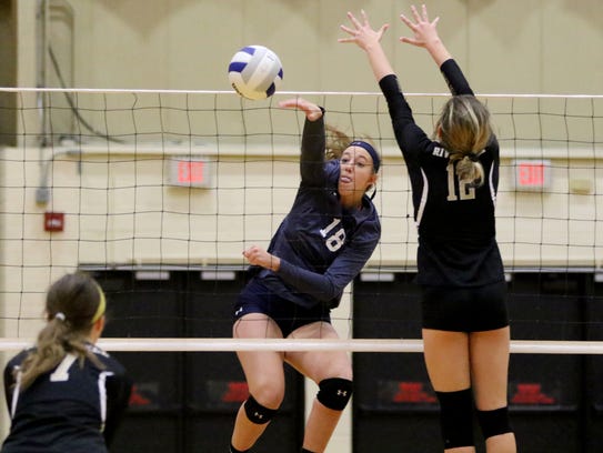 Anna Morris of IHA moves the ball over the net on Sunday.