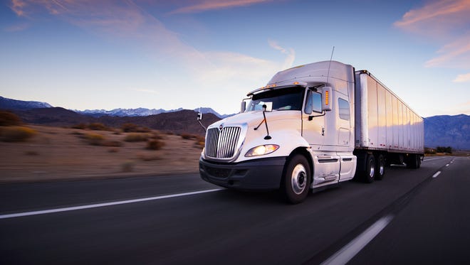 An Atlas Van Lines moving truck drives through a highway. A 2018 study by the company placed Nevada as the top state for inbound movers.