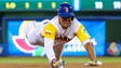 March 12: Colombia's Reynaldo Rodriguez dives for third