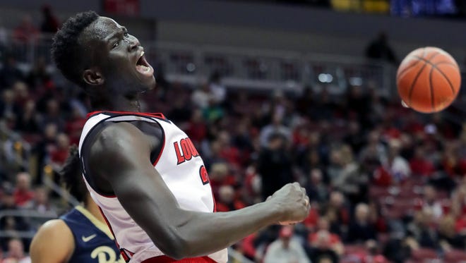 Louisville's Deng Adel yells after getting the foul but missing the bucket. 