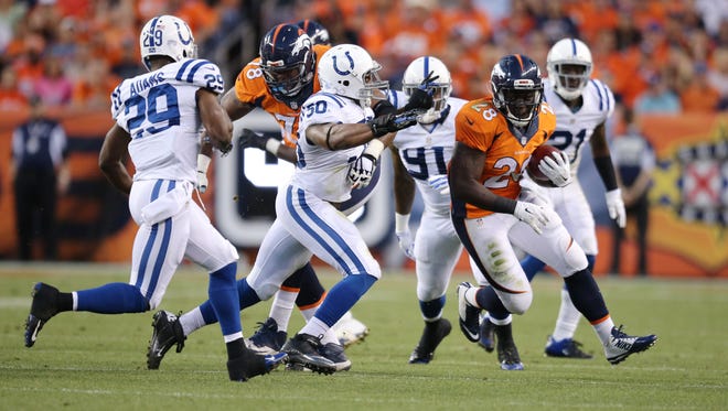 Denver Broncos Montee Ball runs past the Colts defense in the first half.  The Indianapolis Colts play the Denver Broncos Sunday, September 7, 2014, evening at Sports Authority Field at Mile High in Denver CO.