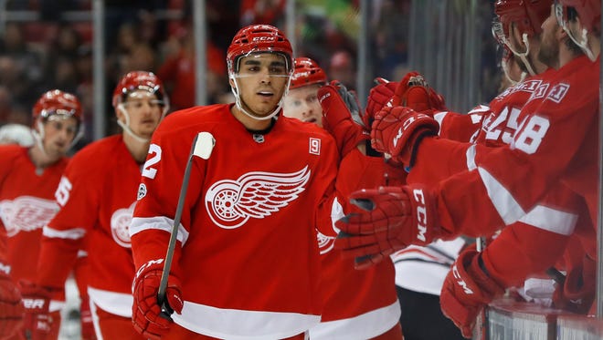 Red Wings center Andreas Athanasiou (72) celebrates his goal in the first period of the Wings' 4-2 win Friday at Joe Louis Arena.