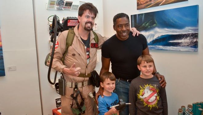 Fans get pictures taken with Ernie Hudson on Saturday at Mainline Arthouse during the Pensacola Pop Expo.